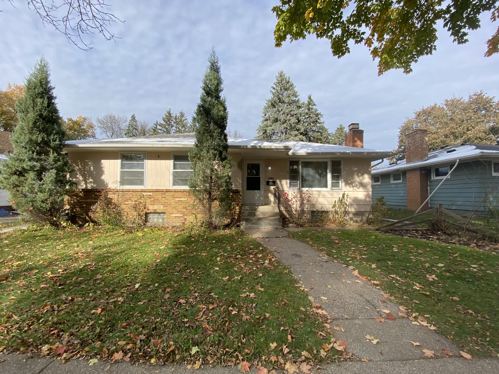 Front of a renovated rambler-style home in St. Paul in autumn